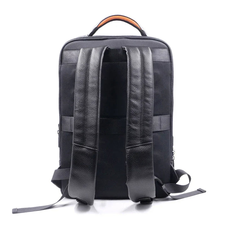 Secure men's anti-theft travel bag: a durable black leather backpack with a convenient fingerprint lock.