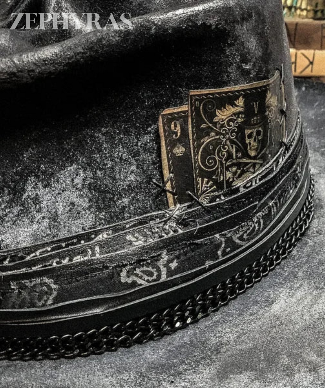 Detailed view of a men's gothic felt hat featuring a dark, edgy raven skull design. Handmade accessory.