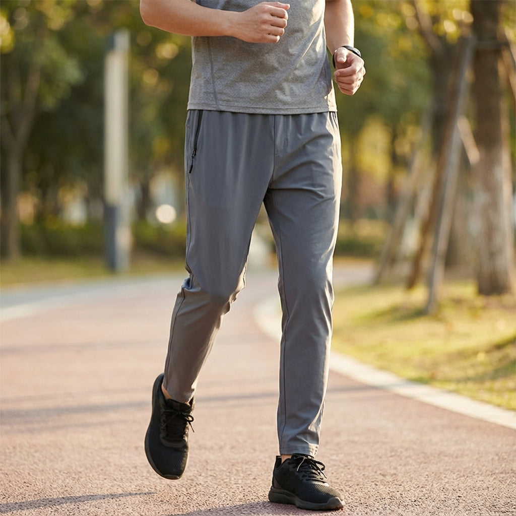 Men's black quick-dry athletic joggers with elastic waist, ideal for sports and leisure wear.