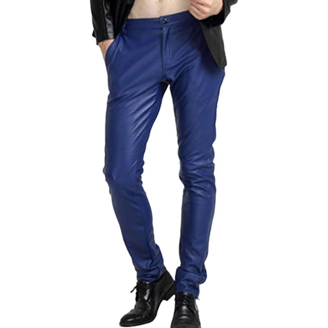 Dynamic pose of a man wearing black tapered faux leather biker trousers