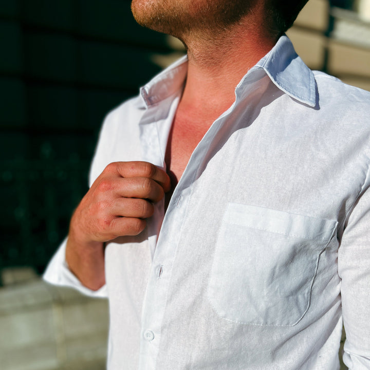 Men's button-up summer shirt paired with sunglasses, perfect for vacation style & sunny casual wear.