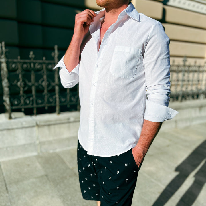 Relaxed fit men's short-sleeve button-up shirt for stylish summer, leisure, & everyday casual wear.