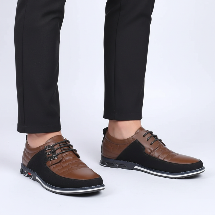 Close-up of 'Bryan' men's luxury black leather dress shoe, highlighting texture.