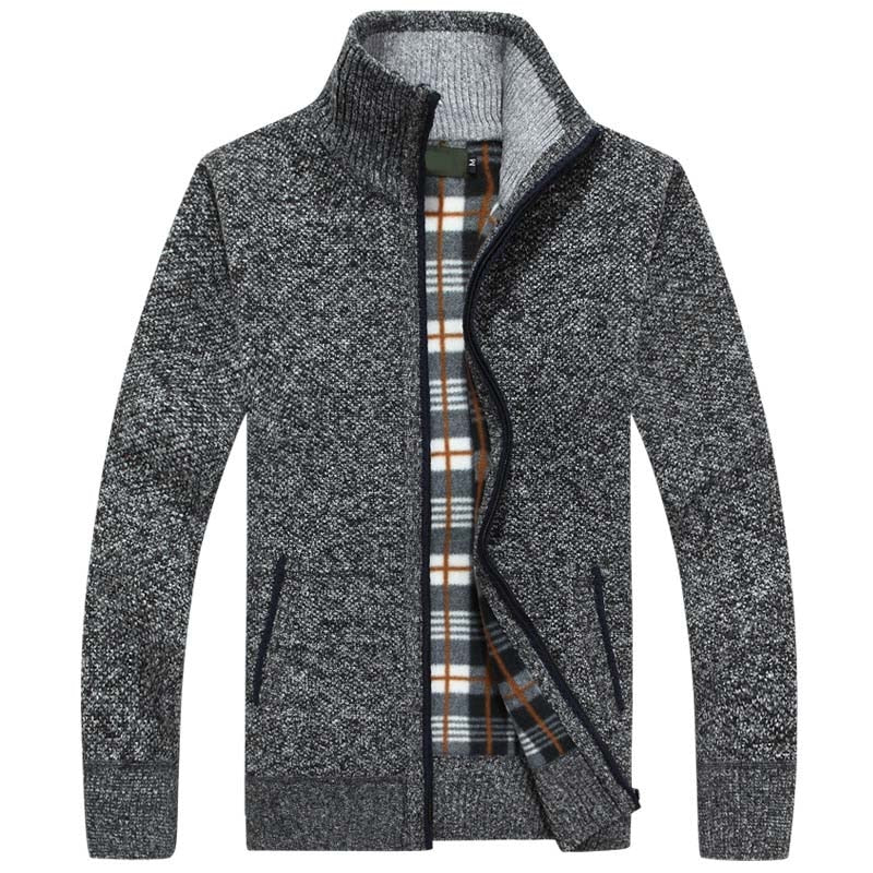 Close-up of a men's zipped cable knit cardigan texture, highlighting the intricate knitting pattern.