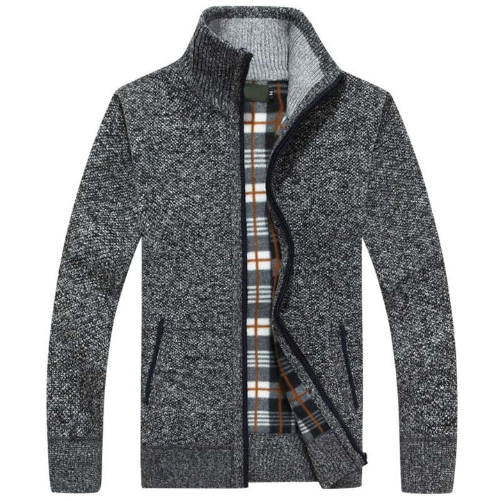 Close-up of a men's zipped cable knit cardigan texture, highlighting the intricate knitting pattern.