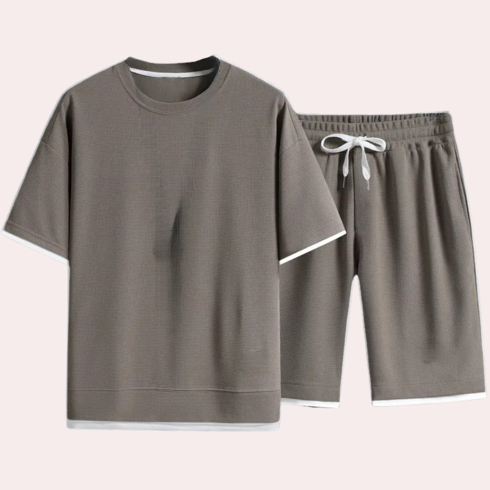 Chic men's casual two-piece summer outfit. Lightweight shirt & shorts ideal for warm weather fashion.