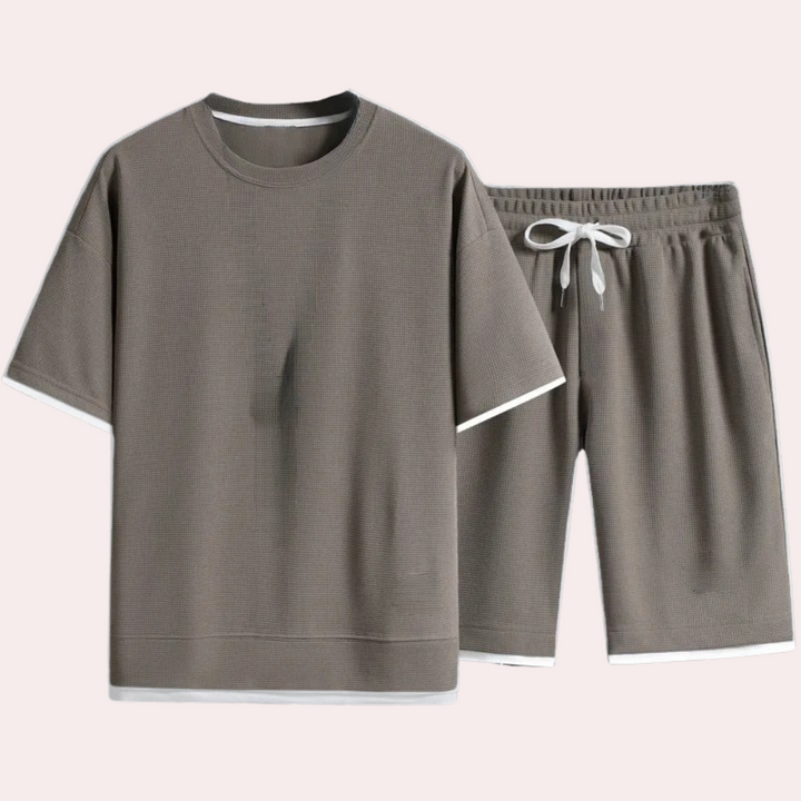 Chic men's casual two-piece summer outfit. Lightweight shirt & shorts ideal for warm weather fashion.