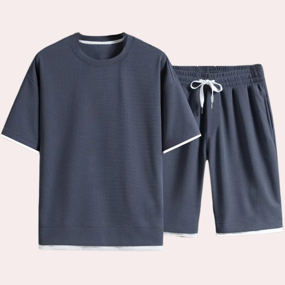 Comfortable polyester men's summer outfit. Casual short-sleeve shirt and matching shorts for relaxed wear.