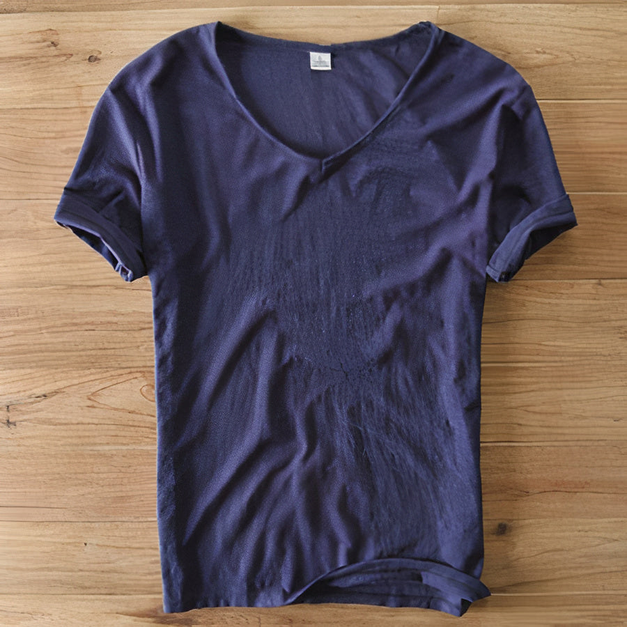 Folded various colored men's casual V-neck t-shirts, ready for summer fashion.