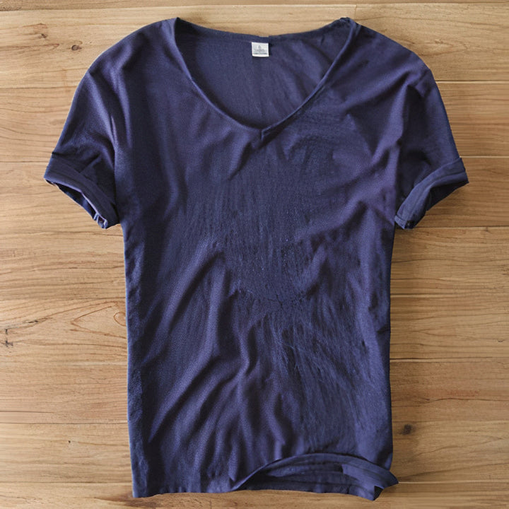 Folded various colored men's casual V-neck t-shirts, ready for summer fashion.