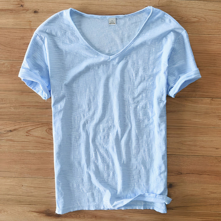 Detail of the V-neck collar on a men's summer t-shirt, highlighting casual style.