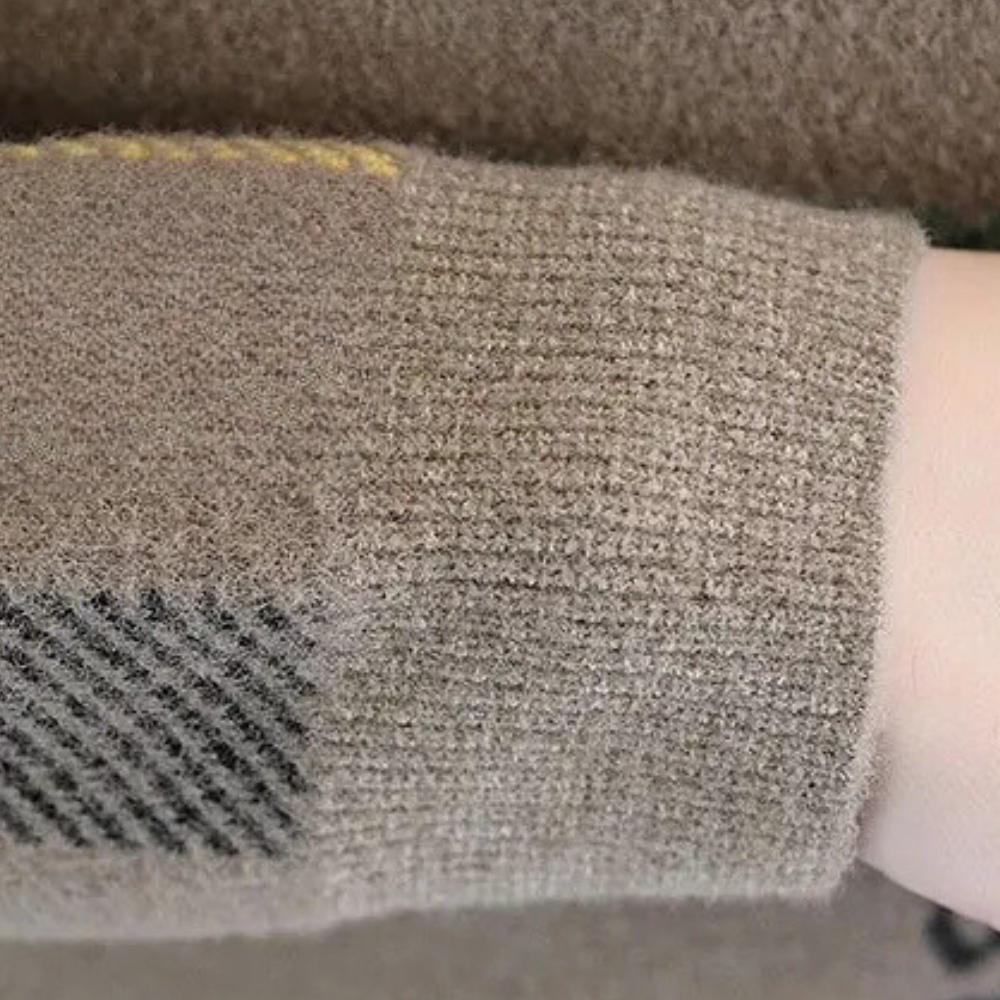 Close-up of a men's comfortable knit sweater texture, highlighting the timeless style for casual wear.
