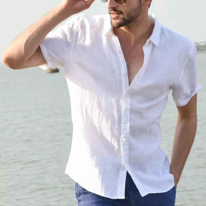 Men's comfort fit linen short sleeve shirt. Relaxed button-down style for warm weather & holiday adventures.