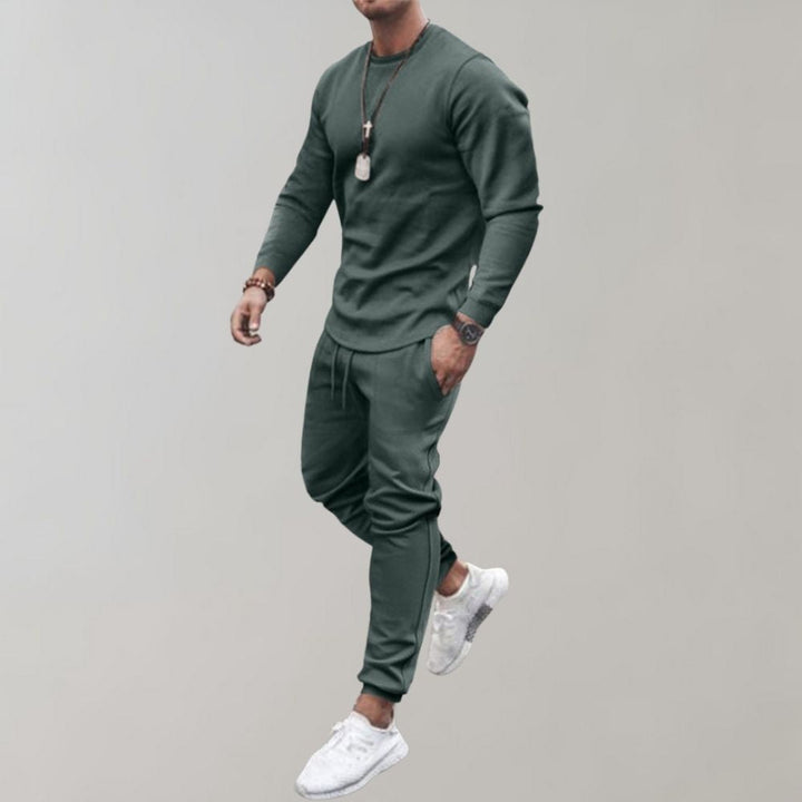 Men's comfortable sporty tracksuit set, perfect for athletic wear, loungewear, or casual outfits. Polyester fabric.