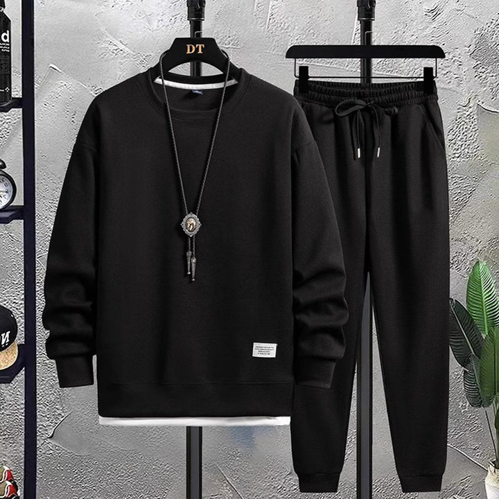 Leisure men's comfortable jogging suit for casual fashion. A stylish matching set for ultimate daily comfort.