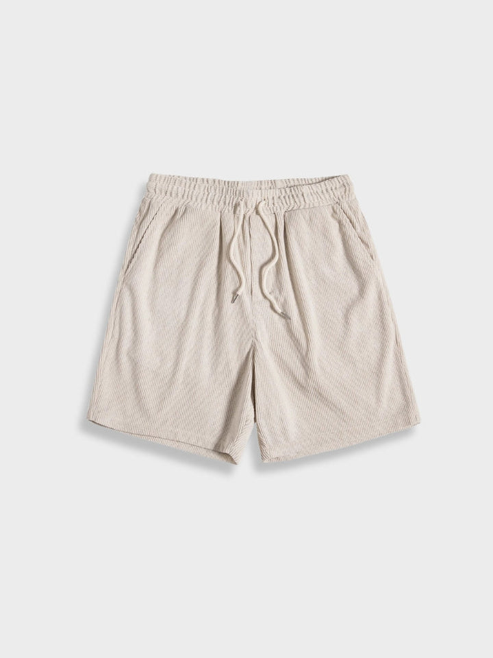 Versatile men's corduroy summer outfit: a relaxed shirt and shorts for ultimate comfort.