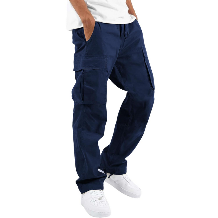 View of a man wearing comfortable cotton cargo joggers, ideal for streetwear fashion