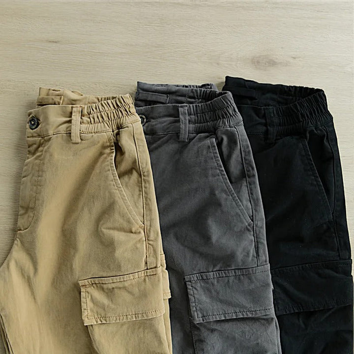 Men's durable hiking trousers with ample cargo pockets for adventure gear.