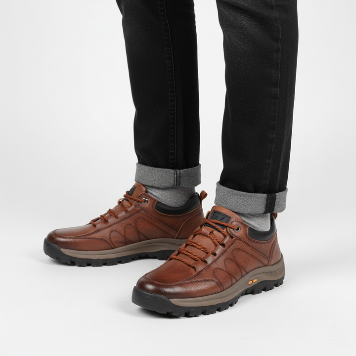 Pair of men's durable trekking shoes made of high-quality leather, lace-up design