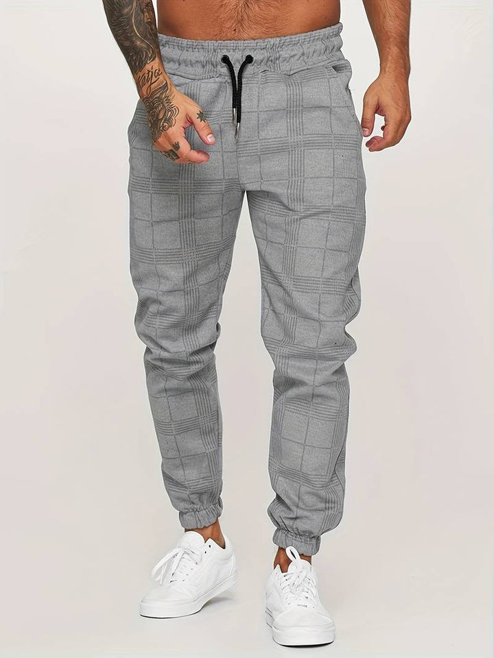 Versatile men's solid jogger sweatpants, ideal for all-season everyday wear.