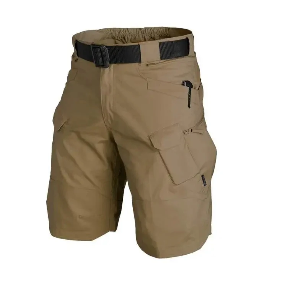 Man wearing FlexTrek Elite men's cargo shorts, demonstrating mobility during an outdoor hike