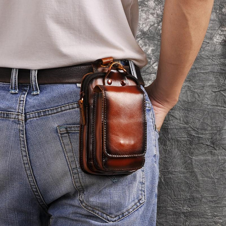 Stylish men's dark brown leather waist pack, ideal for hands-free carrying
