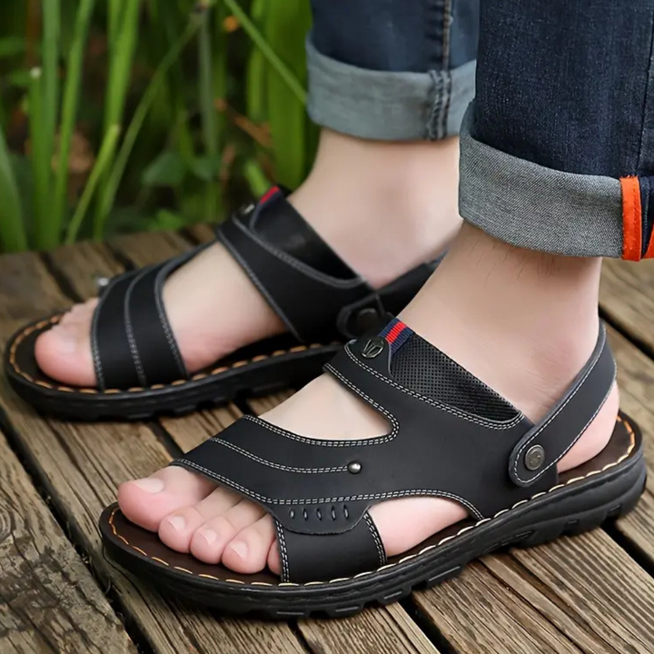 Easy slip-on men's Leon leather sandals. Casual, comfortable, & durable with adjustable straps for summer.