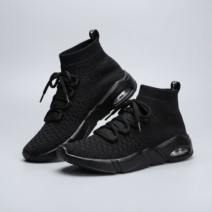 Side view of men's breathable running shoes with a cushioned sole for activewear