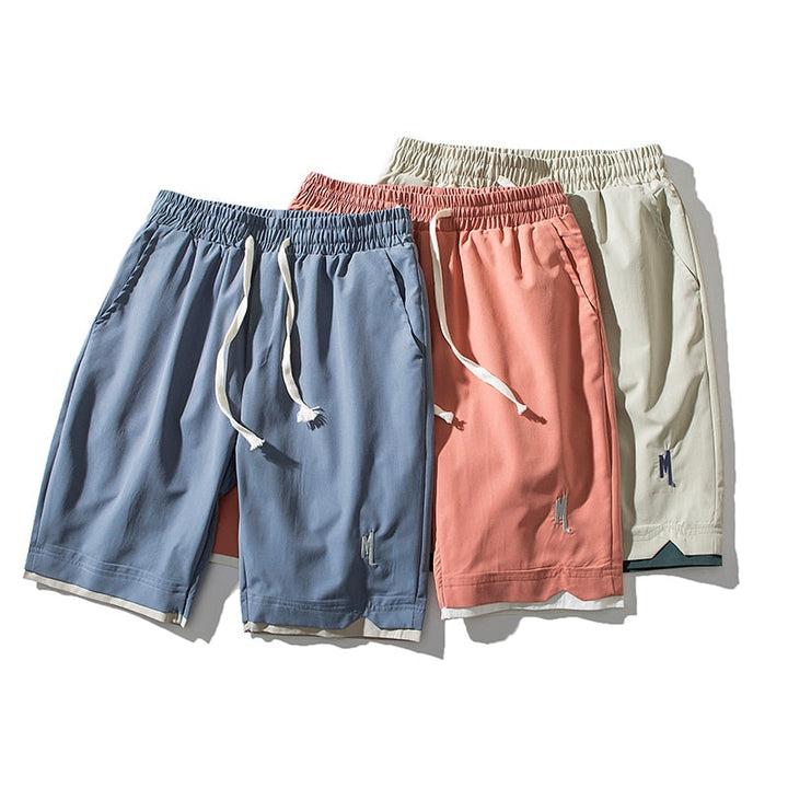 Men's lightweight performance shorts in grey, perfect for summer athletic wear with pockets.