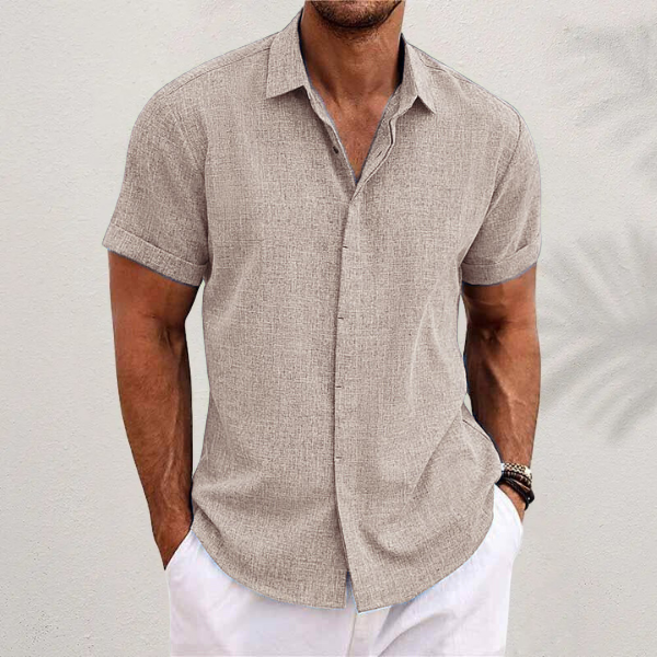 Close-up of the classic collar and button detail on a men's lightweight summer shirt.