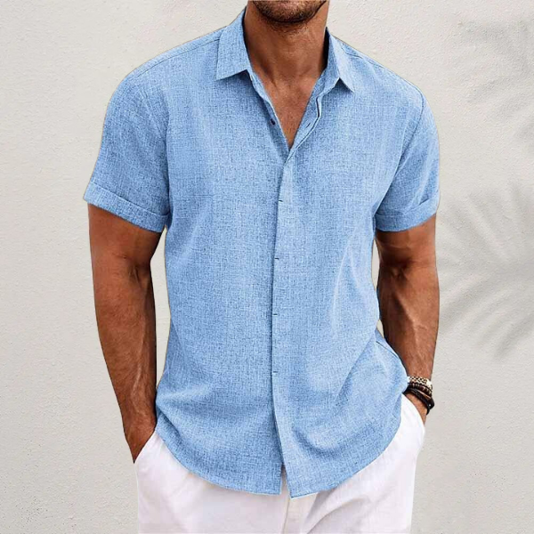 Full view of a man wearing a stylish, breathable short-sleeve summer shirt.
