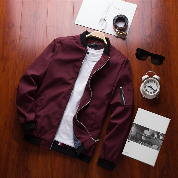 Close-up: Zip detail on men's lightweight summer bomber jacket, casual spring outerwear.