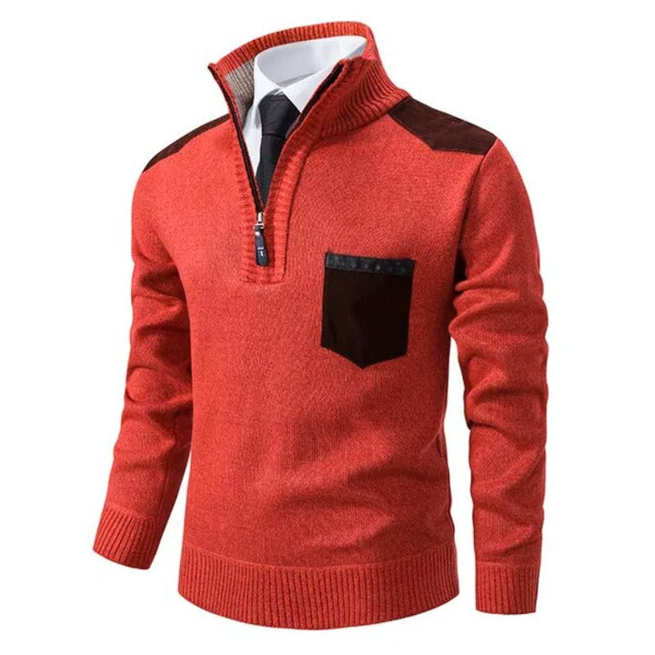 A folded beige men's cashmere quarter-zip jumper, highlighting the premium fabric.