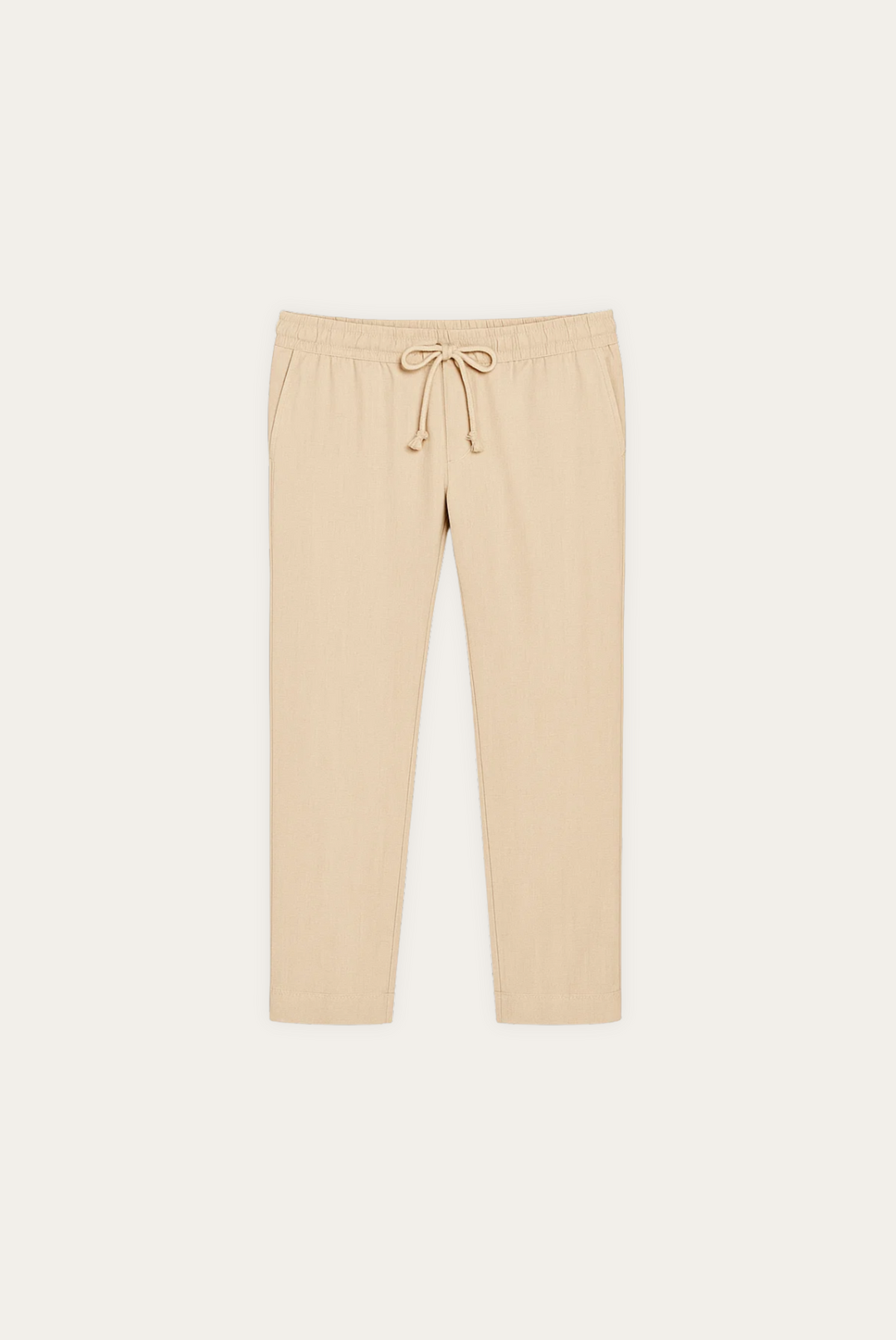Men's modern cut oatmeal linen trousers, tapered and cropped for comfortable, effortless summer style in warm weather.