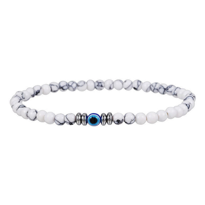 Men wearing natural stone evil eye adjustable protection bracelet. Spiritual gemstone accessory.