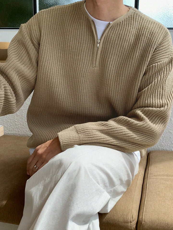 Folded men's oversized zip-up sweater, ready for stylish casual wear and a cozy addition to fall outfits.