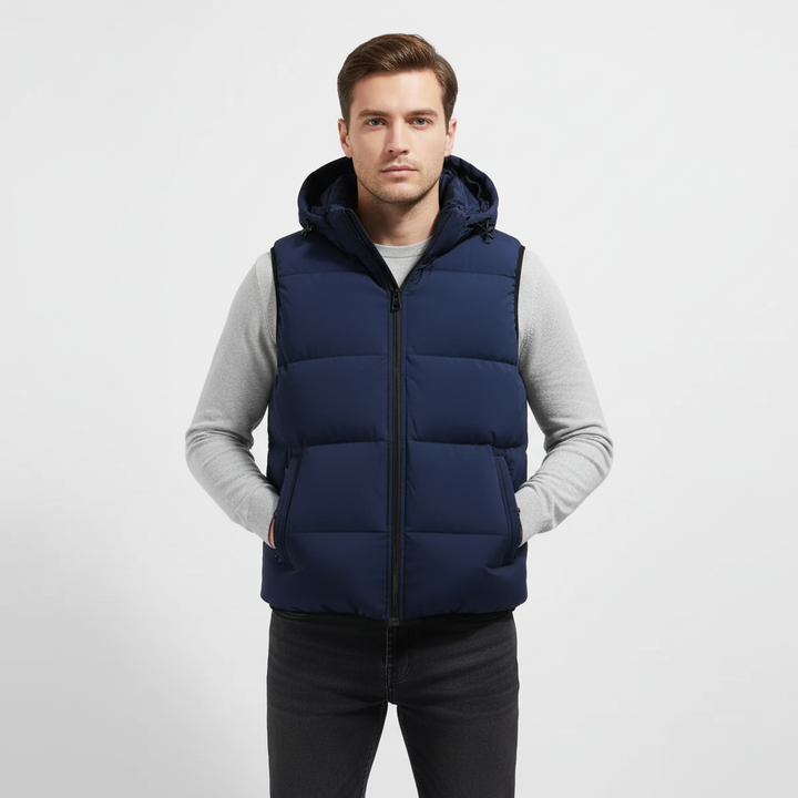 Man wearing a black padded hooded vest, showcasing active wear and autumn fashion
