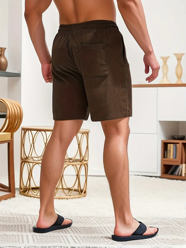 Stylish men's quick-dry swim trunks, adjustable waist, ideal for summer activities.