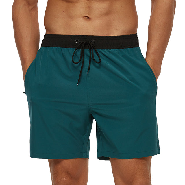Athletic men's swim shorts with elastic waist. Quick-dry for pool and beach activities. Summer fashion essential.