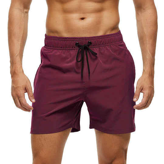 Comfortable men's quick-dry beach shorts. Versatile swimming trunks for pool, vacation & active summer days.