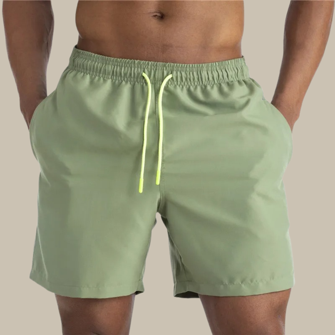 Men's quick-dry mid-length swim shorts in stretch fabric. Perfect activewear for summer beach & pool.
