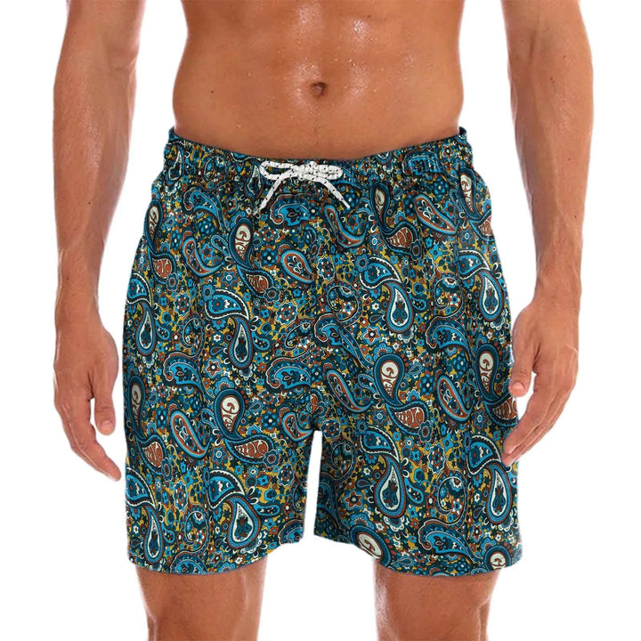 Men's quick-dry swim shorts with vibrant tropical print, perfect for beachwear.
