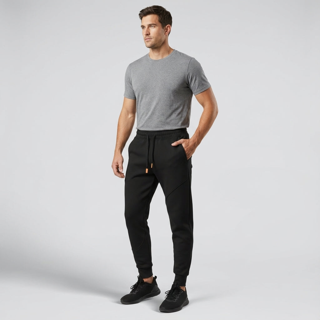 Dark blue men's regular fit athletic jogging pants with elastic waist and cuffs, sportswear.
