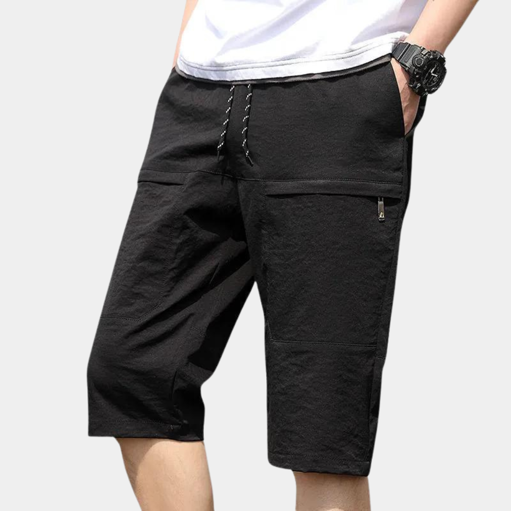 Casual men's Milan cargo shorts in black, featuring comfortable fit and multiple pockets.