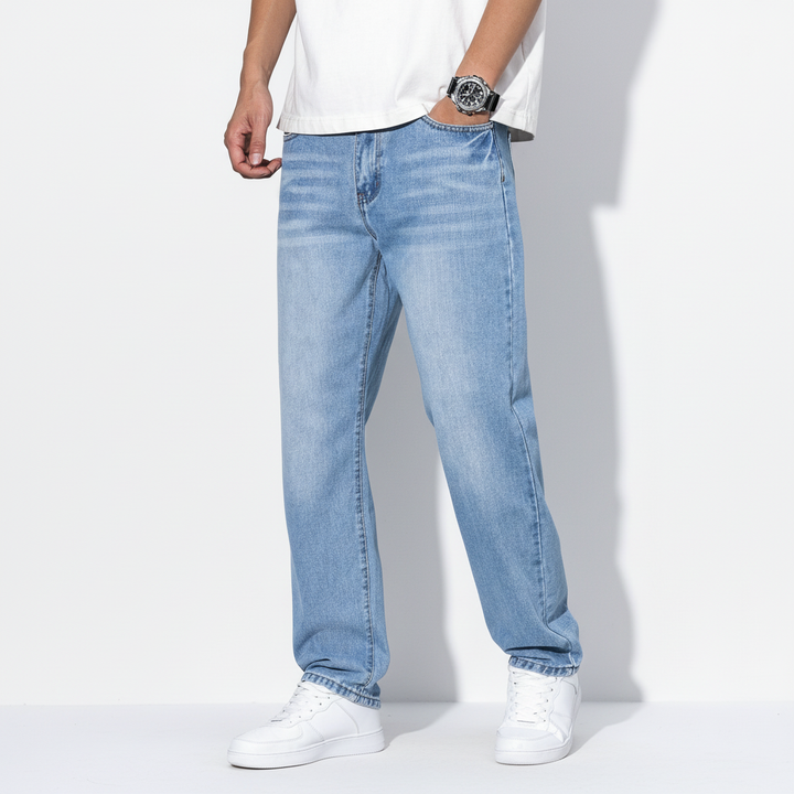 Detail of the stitching and finish on men's casual denim relaxed fit straight leg jeans