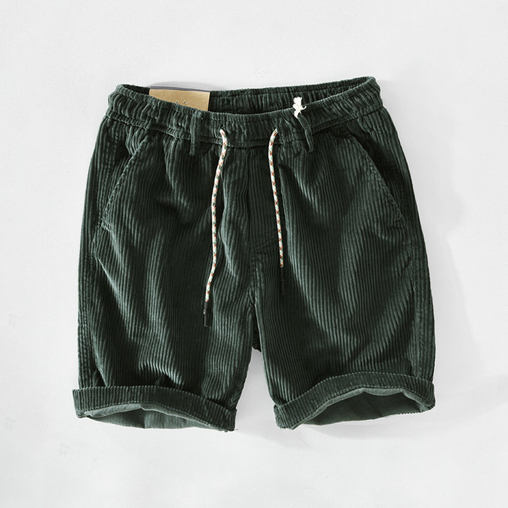 Close-up of men's casual retro corduroy shorts, showcasing soft cotton texture.