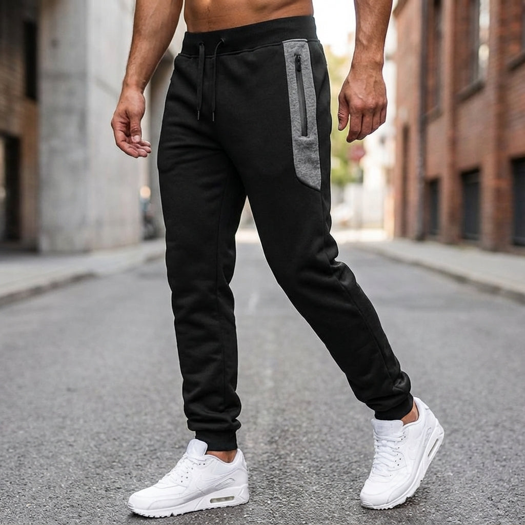 Men's slim fit black jogger pants with zippered pockets, comfortable activewear style