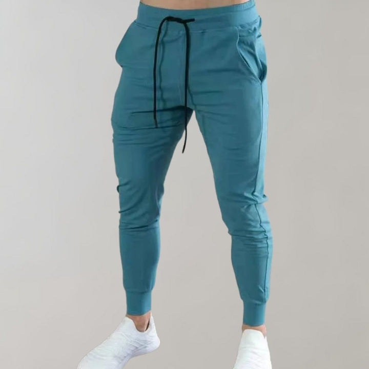 Polyester slim fit jogging trousers for men, Niko brand. Great for sports, gym, or comfortable daily use.
