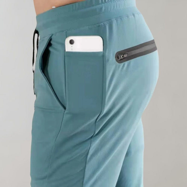 Niko men's slim fit jogging trousers. Comfortable polyester fabric for athletic, workout, & casual wear.