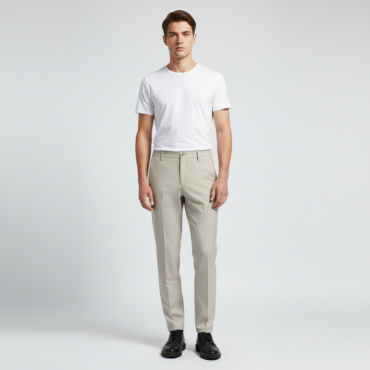 Stylish dark blue men's trousers, comfortable slim fit with elastic waist for modern fashion.